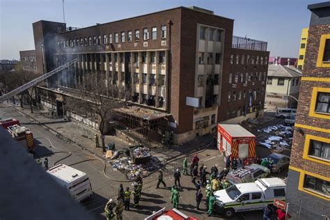 At least 74 are dead, many of them homeless, as fire rips through a rundown building in South Africa